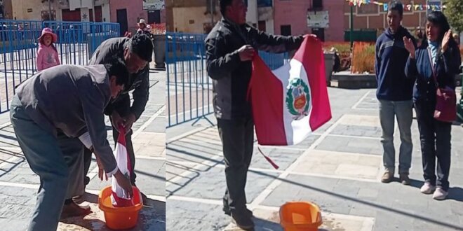 Ciudadanos lavan bandera.